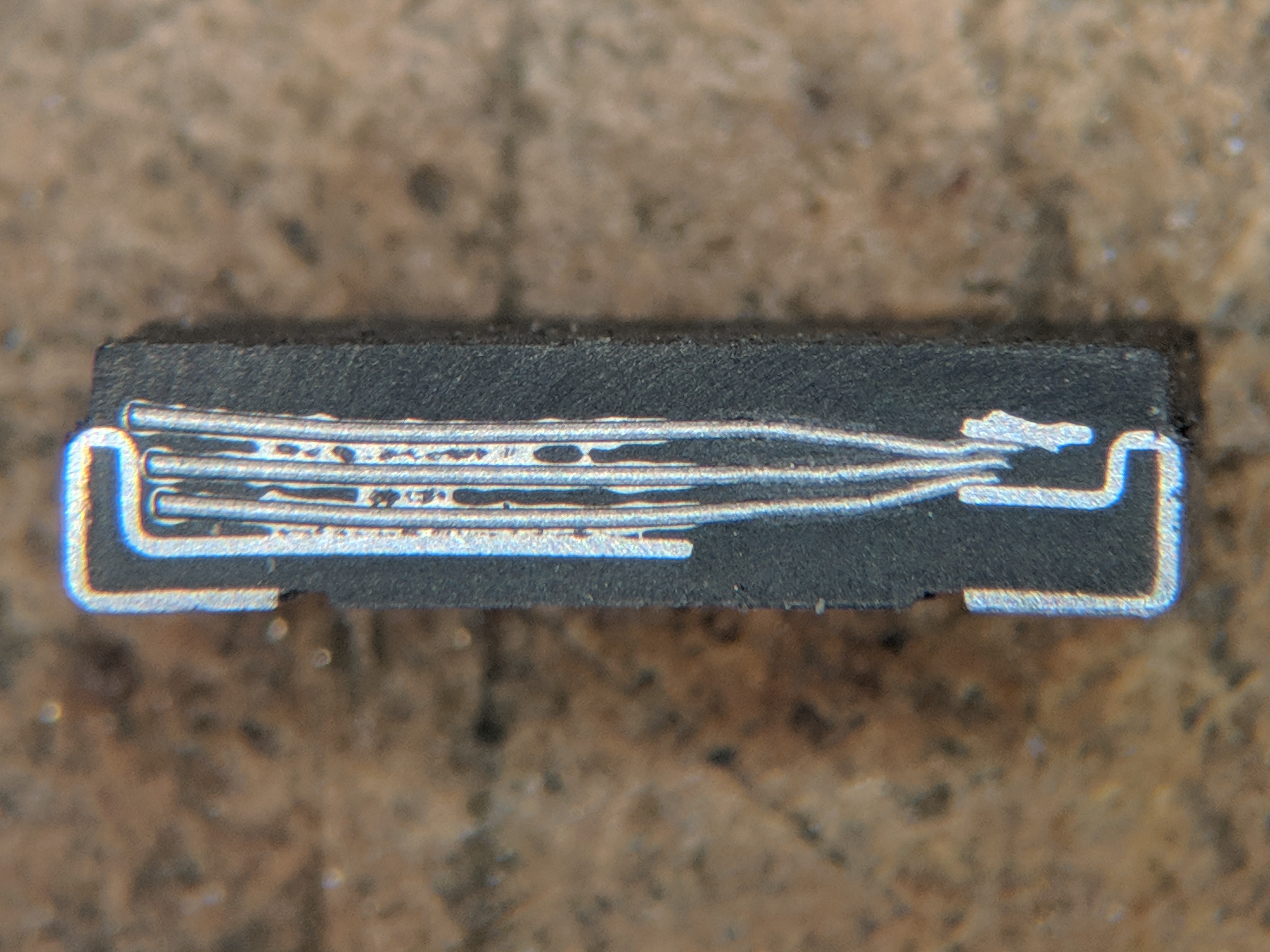 Figure 8 — Cross-section of a solid (polymer) tantalum capacitor. The bulk of the body is the porous sintered tantalum pellet whose enormous internal surface area, coated with a nanometre oxide and…