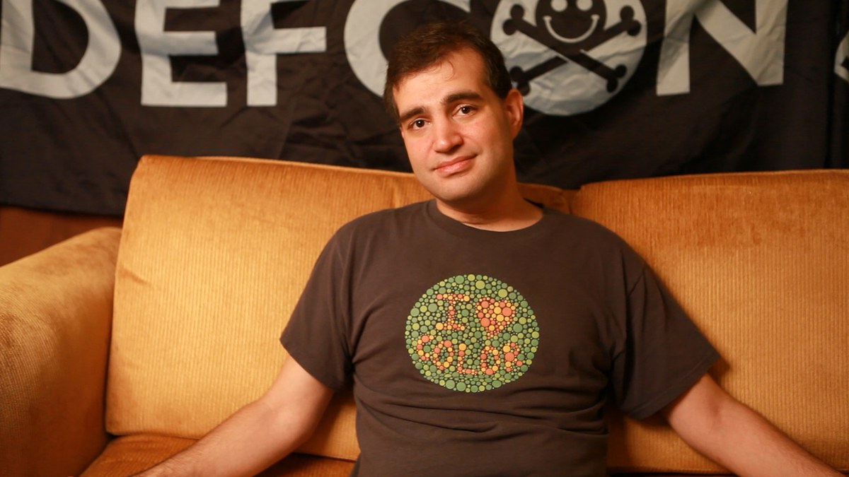 Figure 2 — Dan Kaminsky speaking, 2012. Kaminsky's 2008 disclosure of the DNS cache-poisoning vulnerability — coordinated across 16+ vendors before public release on July 8, 2008 — is the canonical case study…