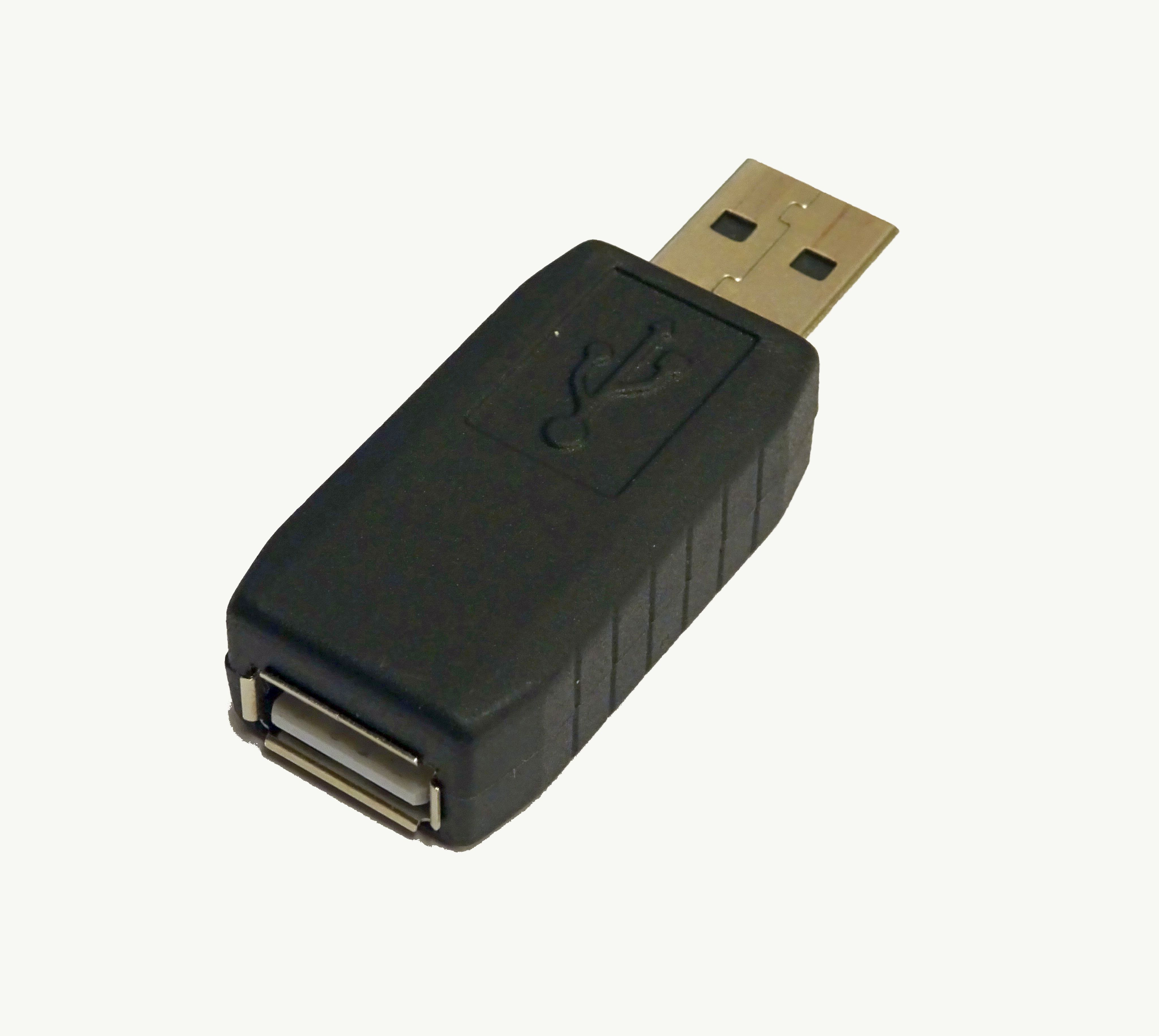 Figure 2 — A typical inline USB hardware keylogger — the canonical reference form factor for the hardware-keylogger category. The device is a small cylinder (~2 cm) that sits between the keyboard's USB cable …