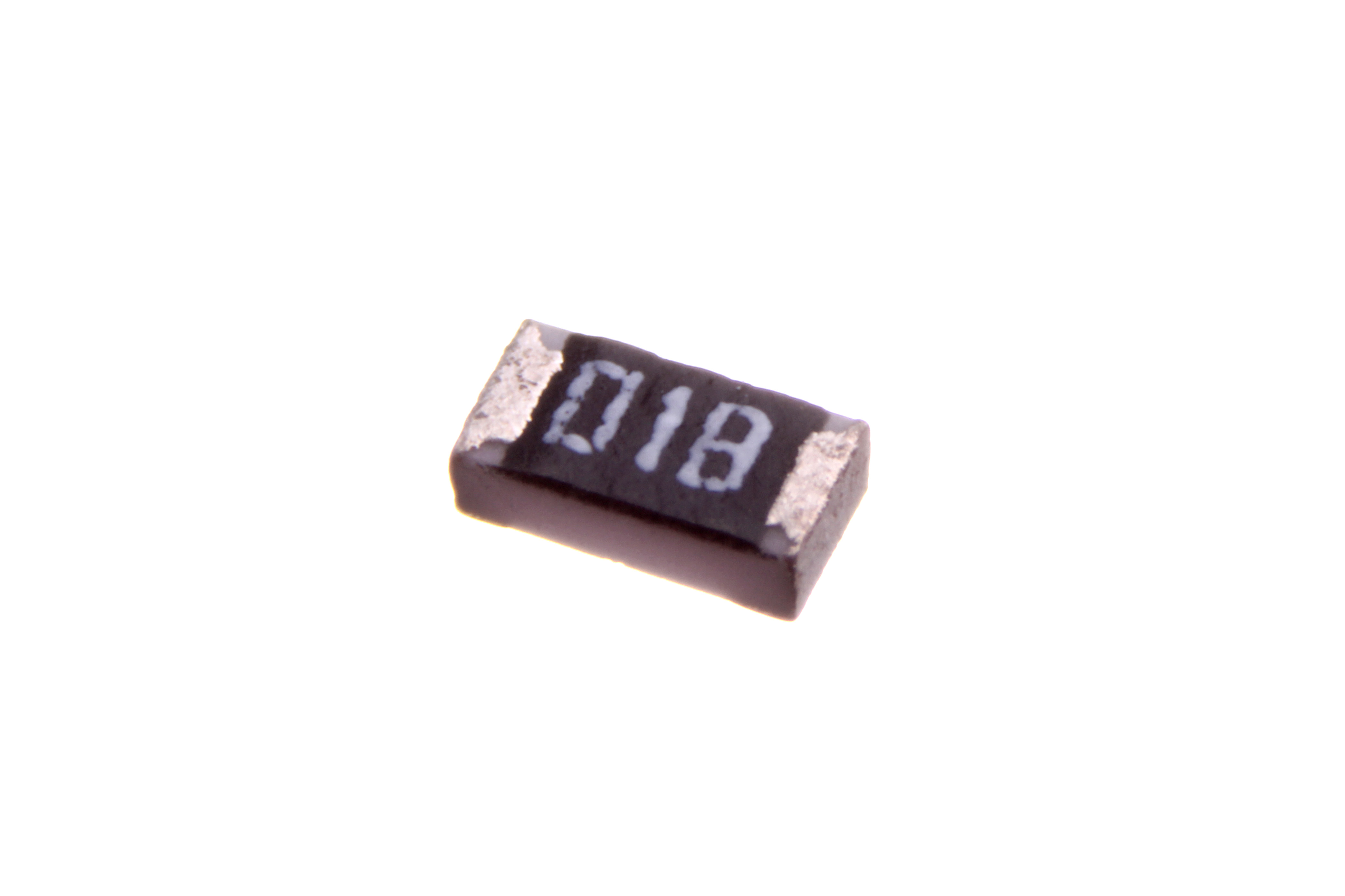 Figure 7 — A real 0603 chip resistor marked "01B" in the EIA-96 code. The two-digit code 01 looks up the E96 value 100, and the letter B is the ×10 multiplier, so 01B = 100 × 10 = 1.00 kΩ, a 1% par…