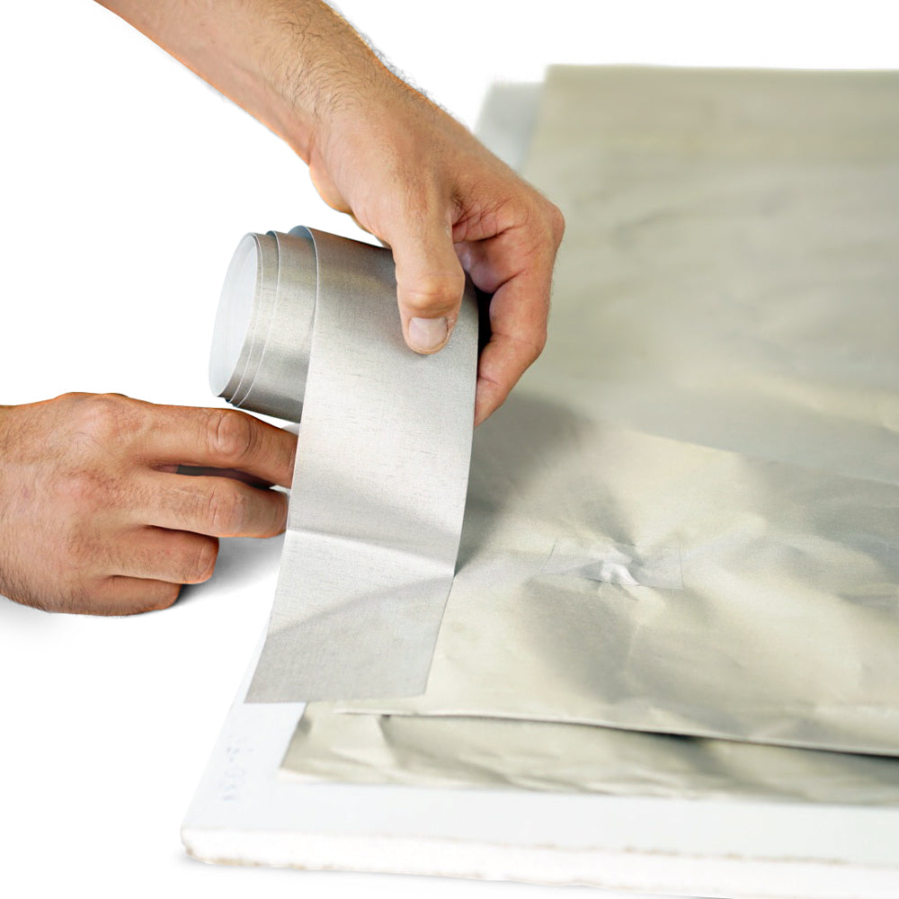 Figure 6 — Bonding a seam with conductive fabric tape. The recurring lesson of the entire deep dive, at hobby scale: the shield is only as good as its worst seam. Overlapped foil, fabric, or mesh m…