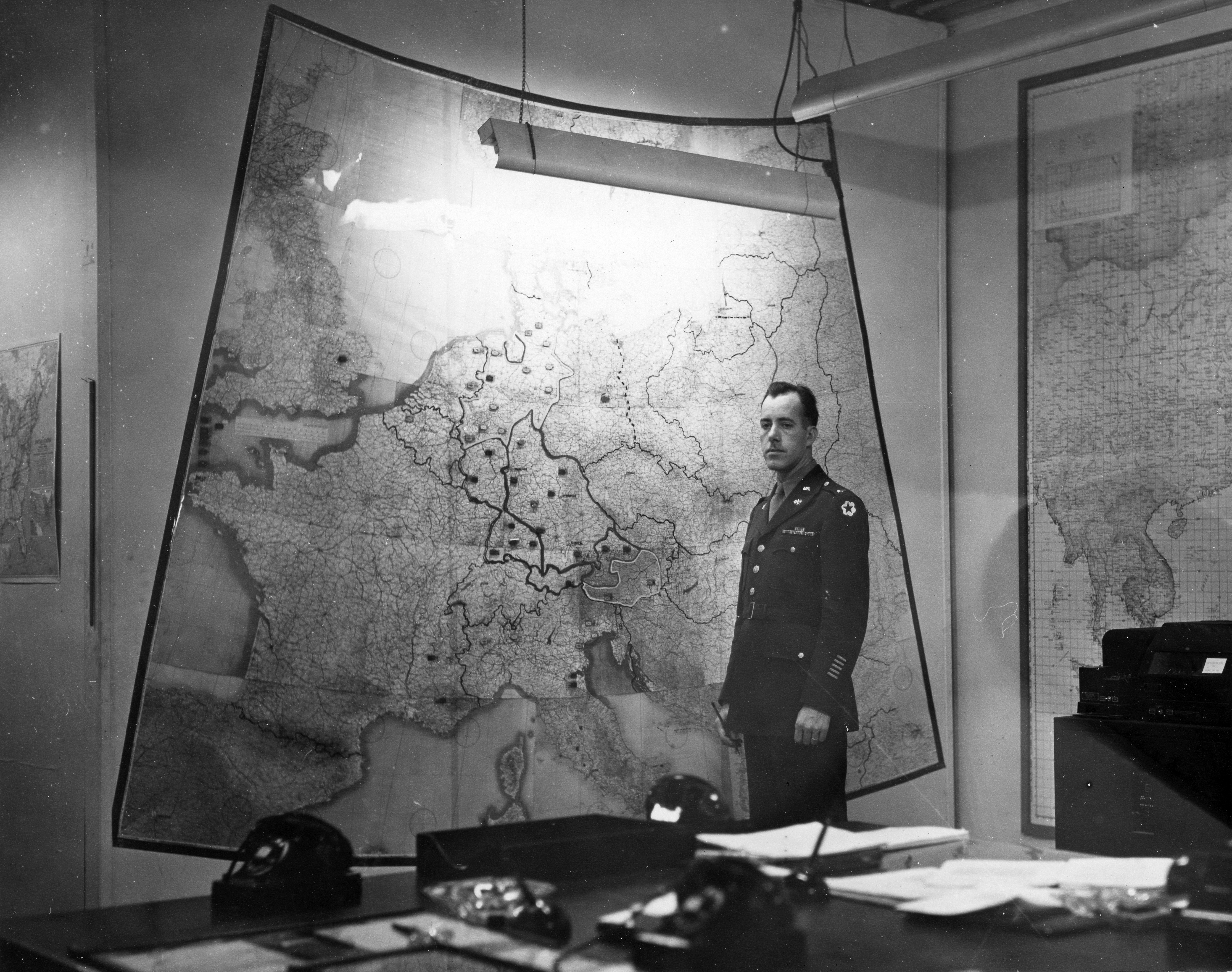 Figure 2 — Franklin Roosevelt's White House Map Room, circa 1943. A converted basement cloakroom run around the clock by Army and Navy watch officers; access was restricted to the President and tho…