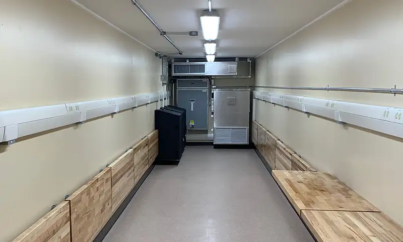 Figure 3 — The same container, inside. Behind the ordinary-looking finish is a hardened, acoustically-treated, RF-attenuating shell; the manufacturer rates this line at roughly 60 dB RF attenuation…