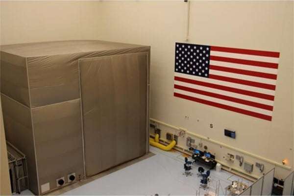 Figure 6 — A large shielded volume built as a room-within-a-room: a fabric-and-foil shielded enclosure standing inside a conventional clean room. The "building-in-a-building" approach isolates the …